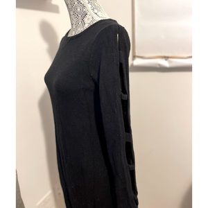 Sweater dress with cut out sleeves.
